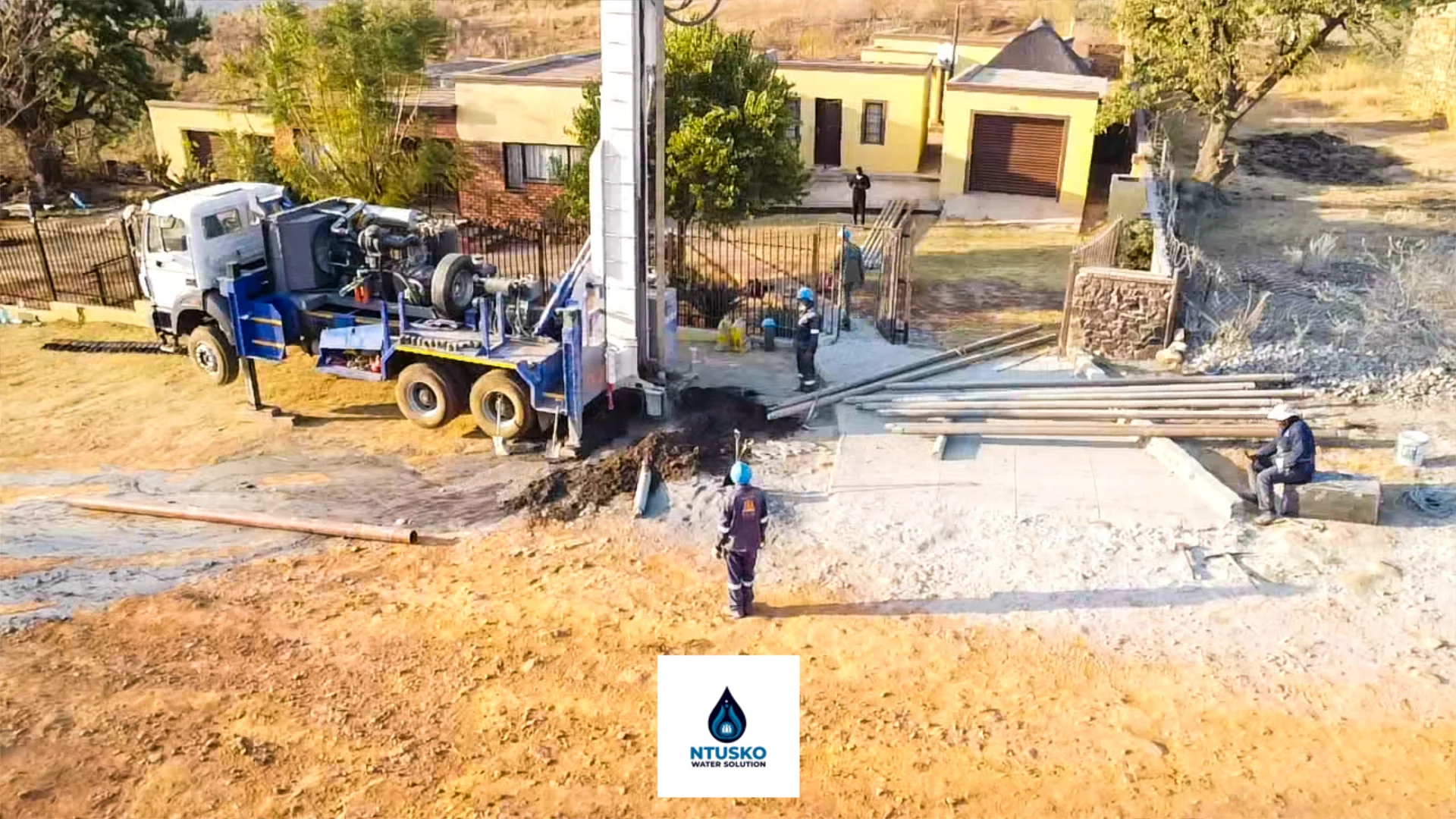 Ntusko drilling team preparing equipment on-site.